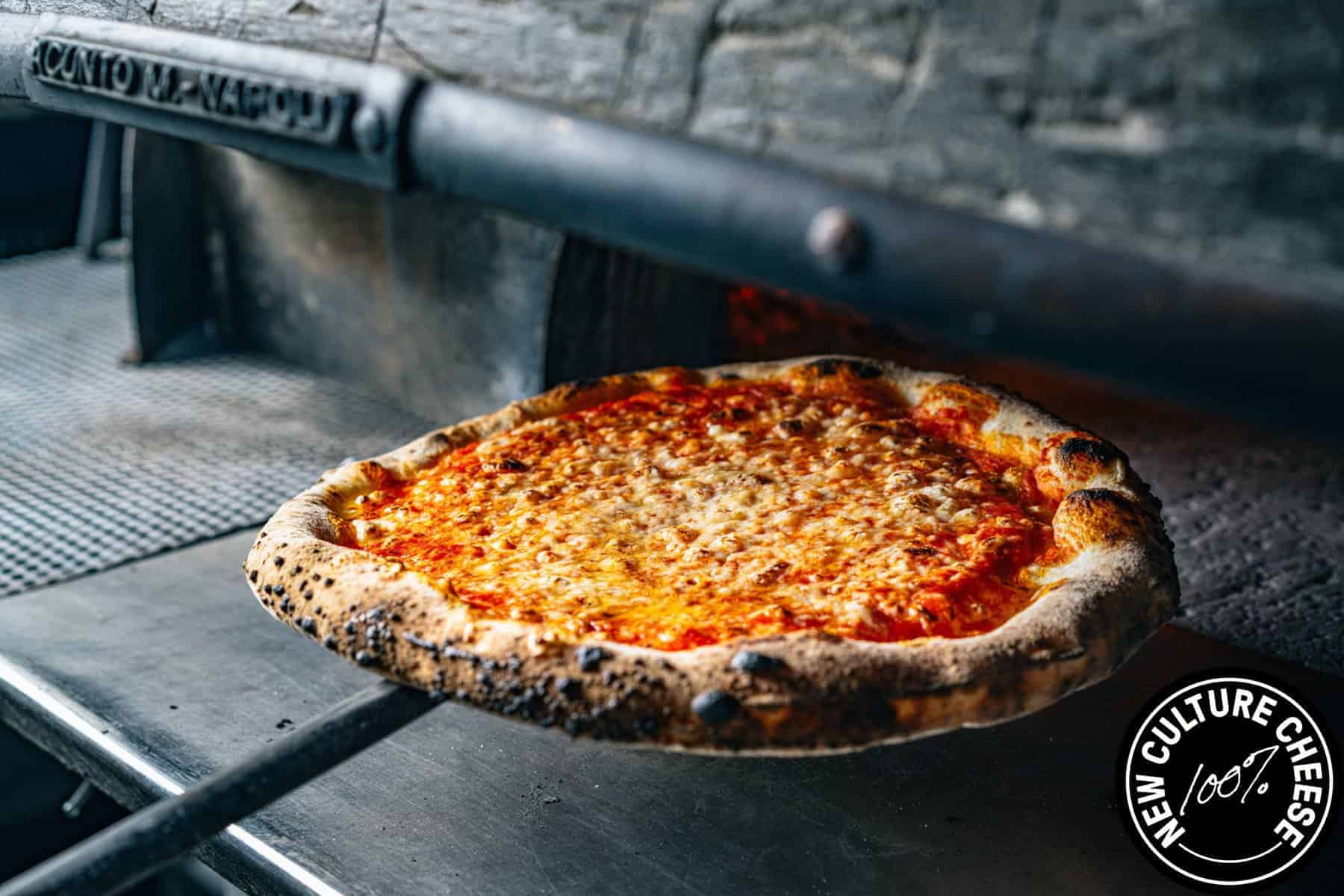 New Culture Cheese Pizza in oven 